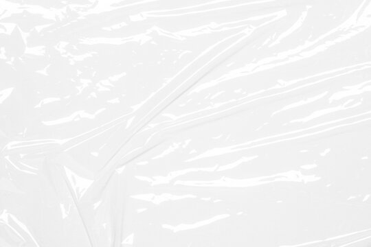 plastic overlay texture of realistic crumpled transparent plastic film wrap on white background,wrinkled stretched plastic effect.abstract plastic background on transparent png