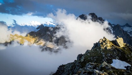 Alpine mountain peaks shrouded in clouds