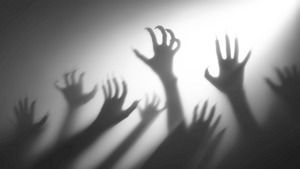 Shadow overlay effect for halloween background with Terrifying scary hands with long nails,Creepy monster claw,silhouette of hands,zombie hand rising out of a graveyard