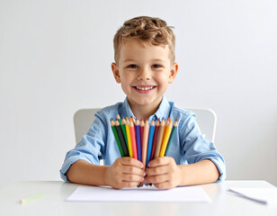 portrait of a smiling child with pencils