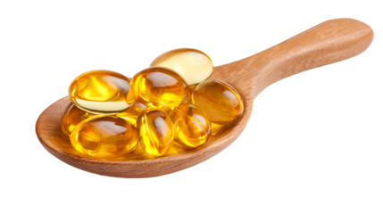 Golden oil capsules in wooden spoon healthy supplement
