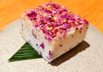 Beautifully Decorated Dessert with Dried Roses on a Plate
