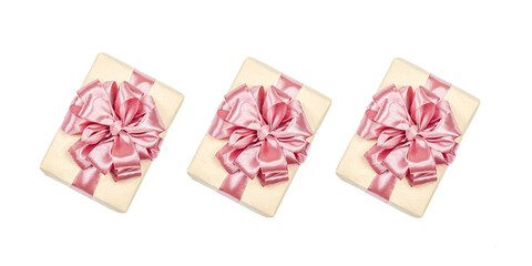 Eco-friendly gift boxes wrapped in kraft paper and decorated with satin ribbons isolated on white