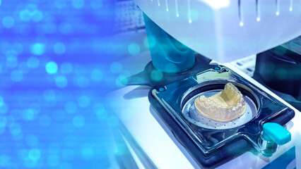 Manufacturing orthodontic prosthesis. Dental technologies. Orthodontic prosthesis inside 3d printer. Production of human jaw models. Dental health concept. Printing dental prosthesis on 3d printer.