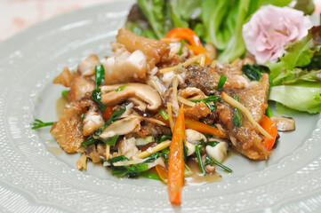stir fried fish , stir fried bass or stir fried mussel with carrot and ginger