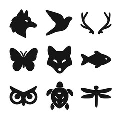 Fototapeta premium Animal Tattoo Icons. Solid, filled icon set of Animal-themed tattoos: wolf head, bird in flight, deer antlers, butterfly, fox face