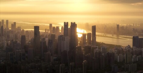 Obraz premium Aerial Golden Hour City Skyline View - Modern Urban Architecture from Unique Adventurous Perspective