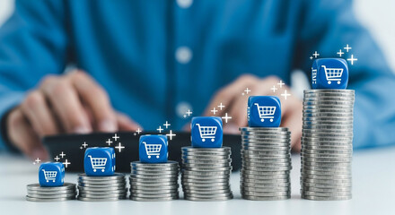 Illustrating the rising cost of living or growing online sales with shopping cart icons on increasing stacks of coins perfect for finance and retail analysis