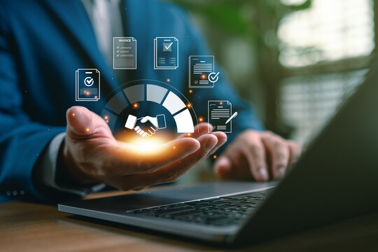 Businessman using digital agreement and contract management platform with virtual handshake and document icons, representing secure business deal, approval and e-signature process.