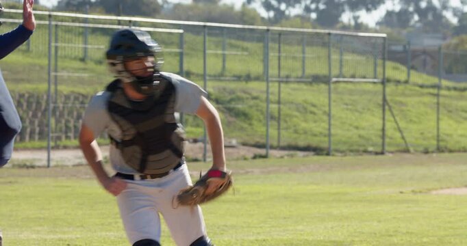 Batter swinging bat at plate on pitch, catcher securing ball, umpire signaling strike, copy space