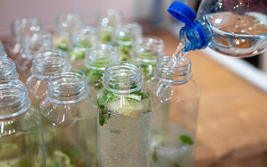 Plastic bottles filled with homemade lime mint soda.