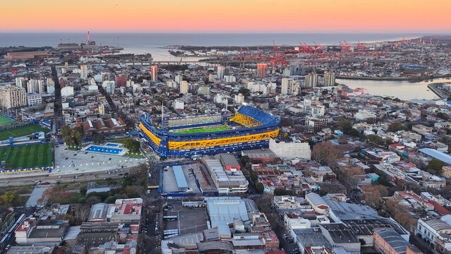Buenos Aires, Argentina, August 10, 2025: Beautiful aerial view of Boca Juniors' "La Bombonera" football stadium at sunset. The city of Buenos Aires can be seen in the background.