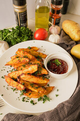 baked potatoes with paprika and garlic, topped with fresh parsley and rich tomato sauce an irresistible homemade dish served fresh from the oven.
