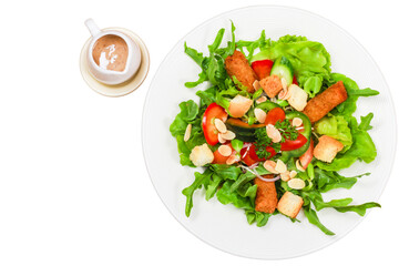 Green salad with bell peppers, sliced almonds croutons and dressing on plate isolated white background. Healthy menu.