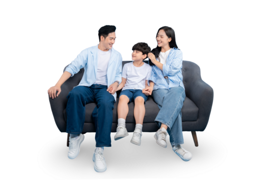 A happy family of three smiling together, sitting comfortably on a sofa on PNG 