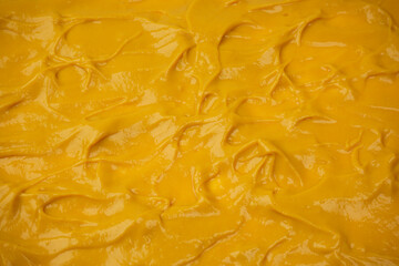 Yellow sauce splashes as a background.