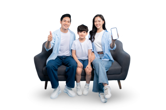 A happy family is sitting on a gray couch. One parent is holding a phone with an empty screen, the other parent is gesturing a thumb up sign. They are all smiling. 