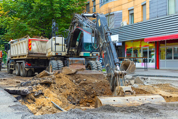 Construction site with modern machines on urban city street © Tatty