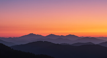 Obraz premium Stunning mountain sunset with vibrant colors and peaceful landscape