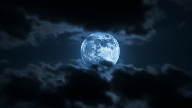 Full Moon Illuminating Night Sky with Cloud Cover in Deep Blue Atmosphere