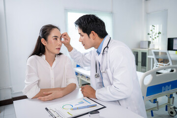 Fototapeta premium A doctor is examining a woman's eye