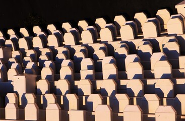 Obraz premium Rows of fences stacked against a black background