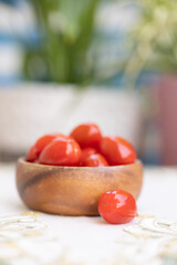 Cherry tomatoes in a wooden bowl