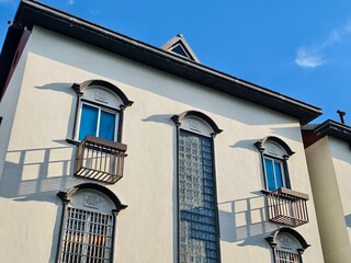 Modern Architectural Facade with Balconies and Clear Skies