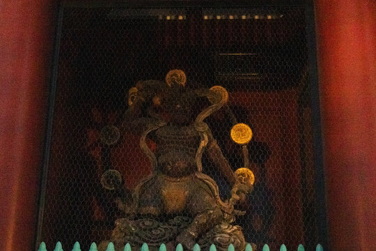 Agyo Raijin god master of thunder and Ungyo Fujin deities of wind at antique Kaminarimon Gate of ancient Senso-ji Temple for local japanese people traveler travel visit at Asakusa city in Tokyo, Japan