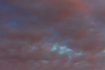 The amazing color of the evening sky and the pattern of clouds on it.