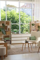 Comfortable armchairs and other furniture in living room. Interior design