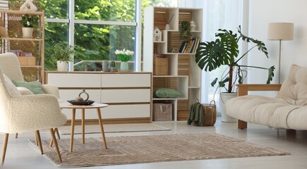Stylish sofa and other furniture in living room. Interior design