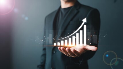 Businessman holding a tablet displaying a rising financial graph with an upward arrow