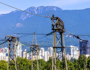 Cityscape with overhead power lines and mountains