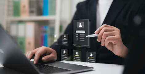 Businessman analyzing and reviewing detailed digital resumes and candidate profiles through modern virtual interface technology for professional recruitment and human resources management