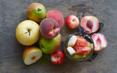 Various autumn fruits are placed under the window.