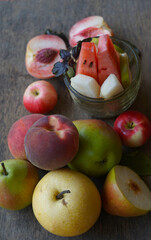 Various autumn fruits are placed under the window.