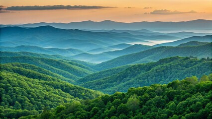 Obraz premium Layered mountain range covered with dense forest under a cloudy sky