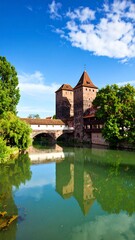 Obraz premium Picturesque European cityscape with a river and bridge