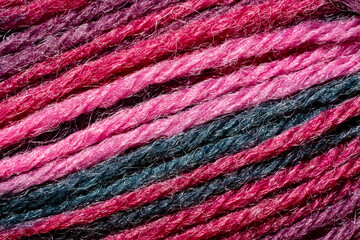 A close up of a pink yarn with a fuzzy texture