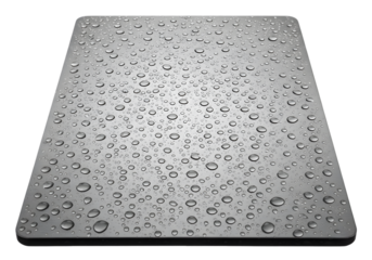 A realistic macro view of water drops covering a sleek grey metallic input device, symbolizing humidity and waterproof technology concepts.