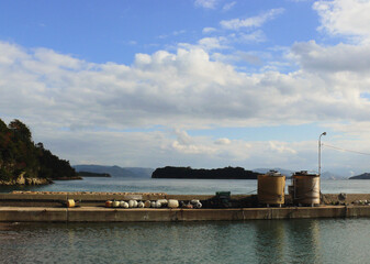 A panoramic view of the Inland Sea of Japan beyound the breakwater forming the fishing port.