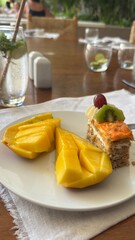 Bowl of fruit salad Delicious ripe mango fruit slices and cubes on plate for healthy eating and tropical dessert recipe Fresh fruit in a wooden bowl. Concept of healthy nutrition.