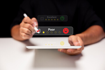 A person is reviewing a service or product using a tablet, displaying ratings from excellent to poor visually.