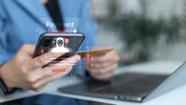 Close-up of a smartphone showing a hacker warning and a payment successful alert, symbolizing online scam, payment fraud, cybercrime, and financial security risk.