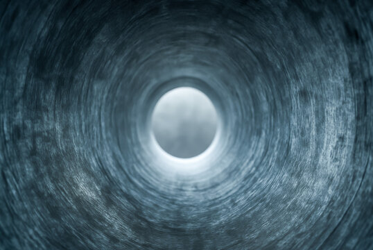Abstract view looking through a circular metal tunnel or pipe - Powered by Adobe