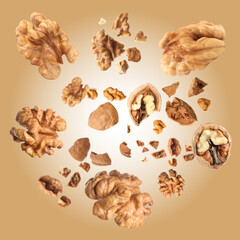 Walnuts swirling in air against pale brown background