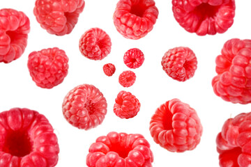 Fresh raspberries swirling in air against white background