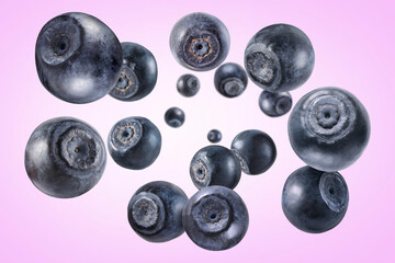 Fresh ripe blueberries swirling in air against violet gradient background