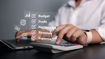 Accounting, financial planning, and business strategy. Close-up of business professional using laptop and calculator with financial checklist icons for budget, profit, net income, revenue, and expense